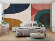 Abstract curved shapes wallpaper in modern living room with gray sofa and natural light