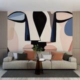 Modern abstract face wallpaper creating an artistic focal point in a minimal Scandinavian living room setting