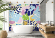 Modern abstract floral wallpaper in pink and blue tones creating a peaceful atmosphere in a bright living room
