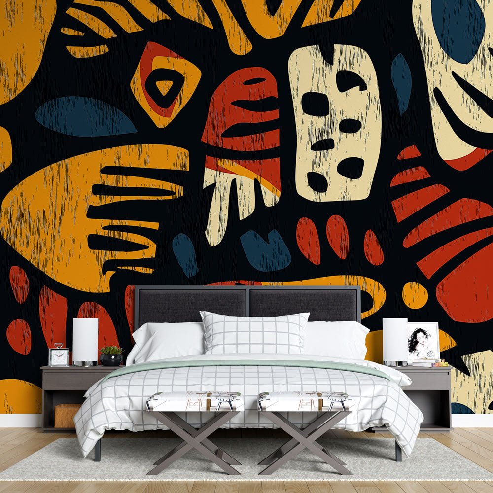 Modern geometric art wallpaper with terracotta and gold tones creating a bold statement wall in a minimal living room setting