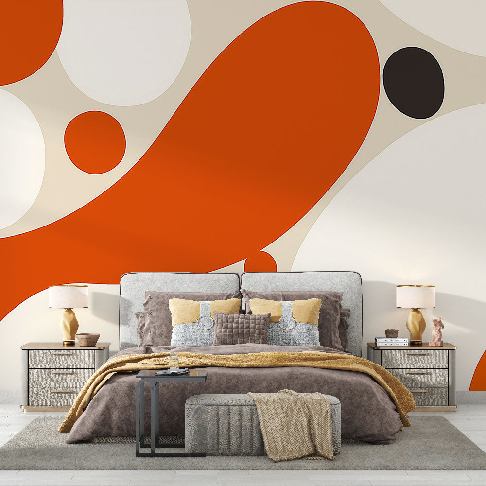 Modern geometric circle wallpaper in orange and black creating a bold statement wall in a minimalist living room setting