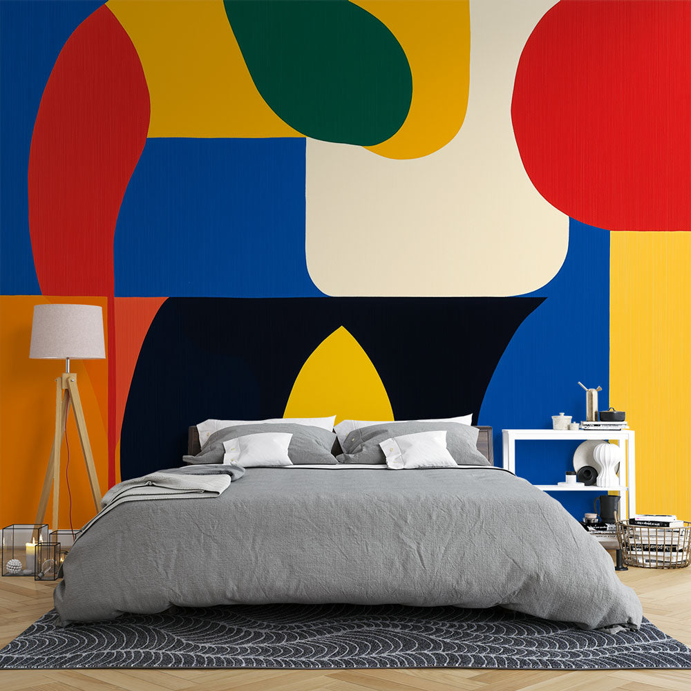 Modern geometric wallpaper with vibrant color blocks creating a bold statement in a minimalist living room setting