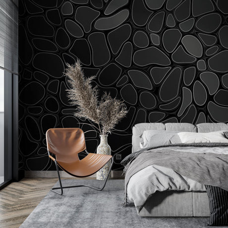 Modern geometric black wallpaper creating depth in a minimalist living room with sleek furniture