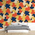 Modern geometric pop art wallpaper creating a bold statement in a minimalist living room with clean lines and contemporary furniture