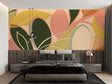 Modern abstract leaf wallpaper creating a fresh focal point in a bright living room with contemporary furniture