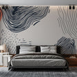 Modern abstract wave wallpaper creating a stunning focal point in a minimalist living room with natural lighting