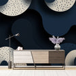 Modern abstract circle wallpaper in navy and beige creating depth in a minimalist living room setting