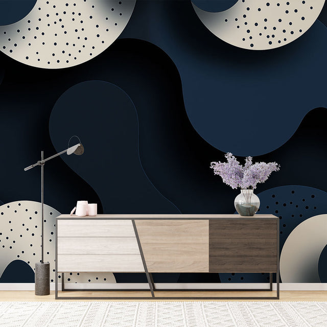 Modern abstract circle wallpaper in navy and beige creating depth in a minimalist living room setting