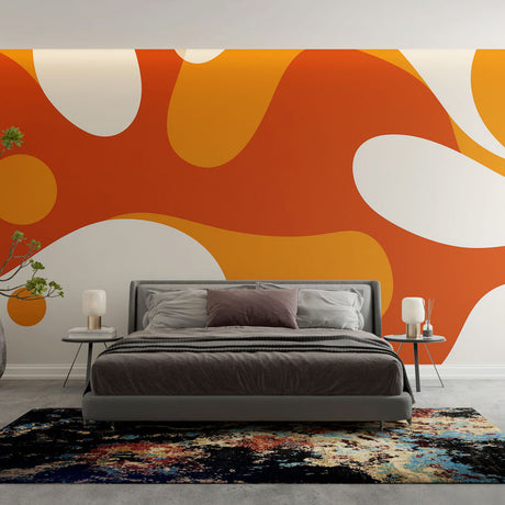 Modern orange abstract wallpaper mural styled in a bright contemporary living room with minimal furniture