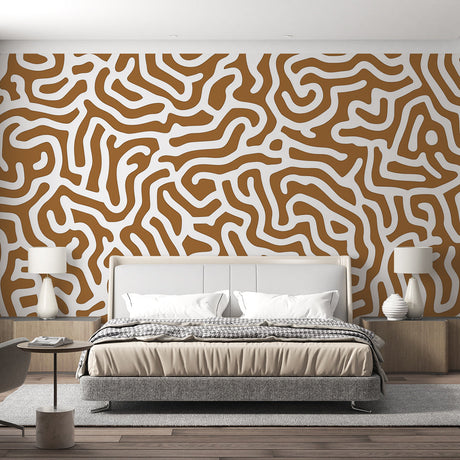 Abstract geometric wallpaper creating a modern focal point in a minimalist living room with natural lighting