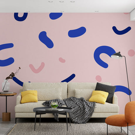 Modern pink and blue abstract wallpaper creating a bold statement wall in a minimalist living room with natural light