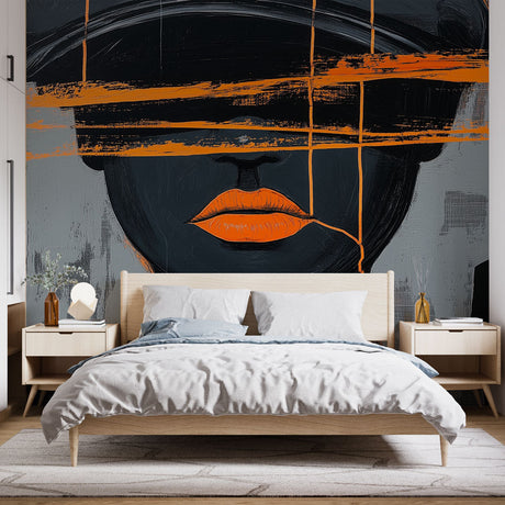 Modern abstract portrait wallpaper creating a bold statement in a minimalist living room with grey furniture and orange accents