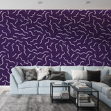 Modern purple wave pattern wallpaper showcased in a minimalist living room with contemporary furniture