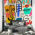 Modern street art wallpaper in bright living room setting with gray sofa and minimalist decor