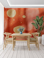 Modern terracotta abstract wallpaper with gold circles in a bright living room setting