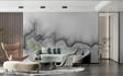 Modern grey abstract cloud wallpaper in a minimal living room setting with contemporary furniture