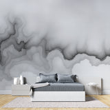 Watercolor cloud wall mural bringing calm to a modern hallway with pendant lighting