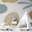 Modern abstract wallpaper with curved shapes in a bright nursery, creating a calm and nurturing space