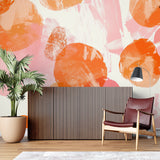 Contemporary office space with orange and pink abstract wallpaper creating an energetic atmosphere