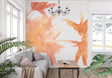 Abstract orange watercolor wallpaper creating a warm atmosphere in a modern living room