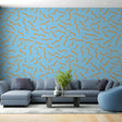 Modern abstract wave wallpaper in bright living room, orange curved pattern on blue background creating depth and movement