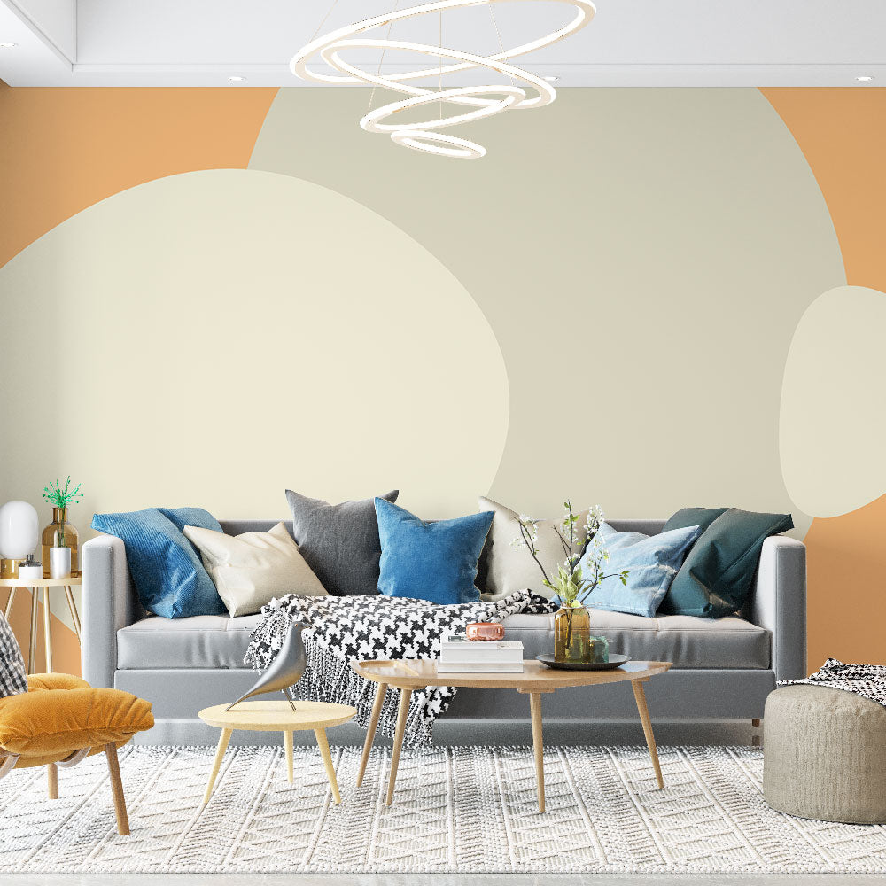 Abstract circle wallpaper creating a warm, modern atmosphere in a minimalist living room with beige and orange tones