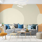 Abstract circle wallpaper creating a warm, modern atmosphere in a minimalist living room with beige and orange tones
