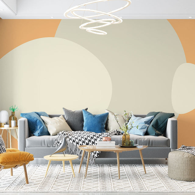 Abstract circle wallpaper creating a warm, modern atmosphere in a minimalist living room with beige and orange tones