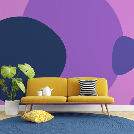 Modern abstract circle wallpaper in purple and pink tones creating a cozy atmosphere in a minimalist living room