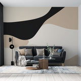 Modern Abstract Wall Mural with organic curves in black and beige transforms this minimalist living room into an art gallery