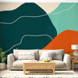 Modern abstract wallpaper with green and orange curves shown in a bright living room setting with minimalist furniture