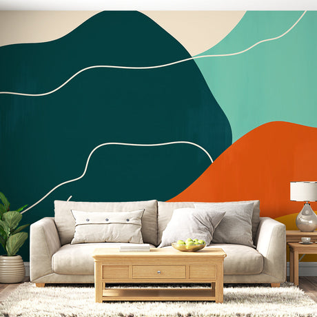 Modern abstract wallpaper with green and orange curves shown in a bright living room setting with minimalist furniture