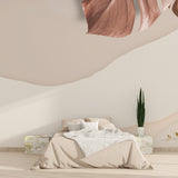 Abstract terracotta leaf wallpaper creating a warm atmosphere in a modern living room