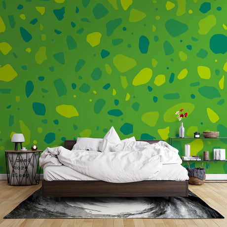 Green terrazzo abstract wallpaper in a bright modern living room, showing how the organic pattern creates a fresh, natural atmosphere