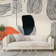 Abstract line art wallpaper with terracotta accent creating a calm modern living room with natural light