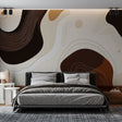 Abstract brown and beige wallpaper creating a warm, modern atmosphere in a minimalist living room with natural light