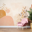 Modern abstract wall mural with organic shapes in terracotta and pink tones creating a calm atmosphere in a minimalist living room