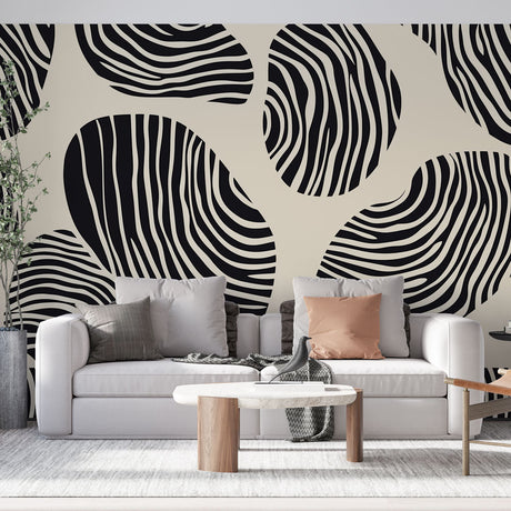 Abstract geometric wallpaper with black and white stripes showcased in a modern minimalist living room setting