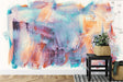 Abstract wall mural in modern living room featuring soft turquoise and coral brushstrokes