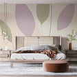 Abstract leaf wallpaper in soft pastel tones creating a serene atmosphere in a modern living room setting