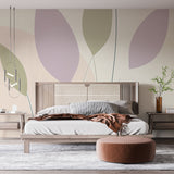 Abstract leaf wallpaper in soft pastel tones creating a serene atmosphere in a modern living room setting
