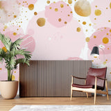Abstract pink and gold dotted pattern mural in a teenage bedroom showing metallic accents