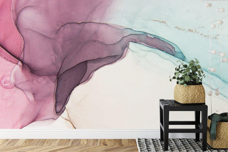 Pink and mint abstract watercolor wallpaper in a modern living room with natural light
