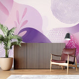 Pink and purple geometric wallpaper in modern living room creating a bold accent wall