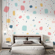 Modern geometric dot wallpaper bringing life to a bright home office space, with desk and creative workspace setup