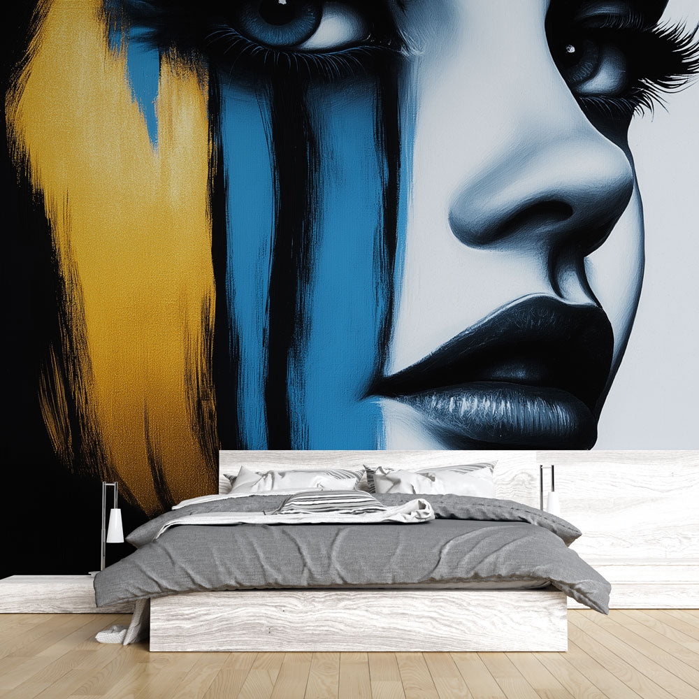 Modern abstract portrait wallpaper with gold accents creating dramatic impact in a minimalist living room setting