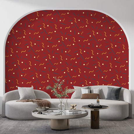 Modern red geometric wallpaper creating a bold statement wall in a contemporary living room with natural lighting