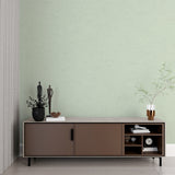 Abstract sage wallpaper creating calm atmosphere in minimalist bedroom setting