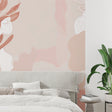 Pink floral abstract wallpaper creating a peaceful atmosphere in a modern minimalist living room