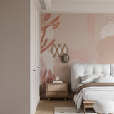 Abstract floral wall mural bringing soft pink tones to a contemporary bedroom setting